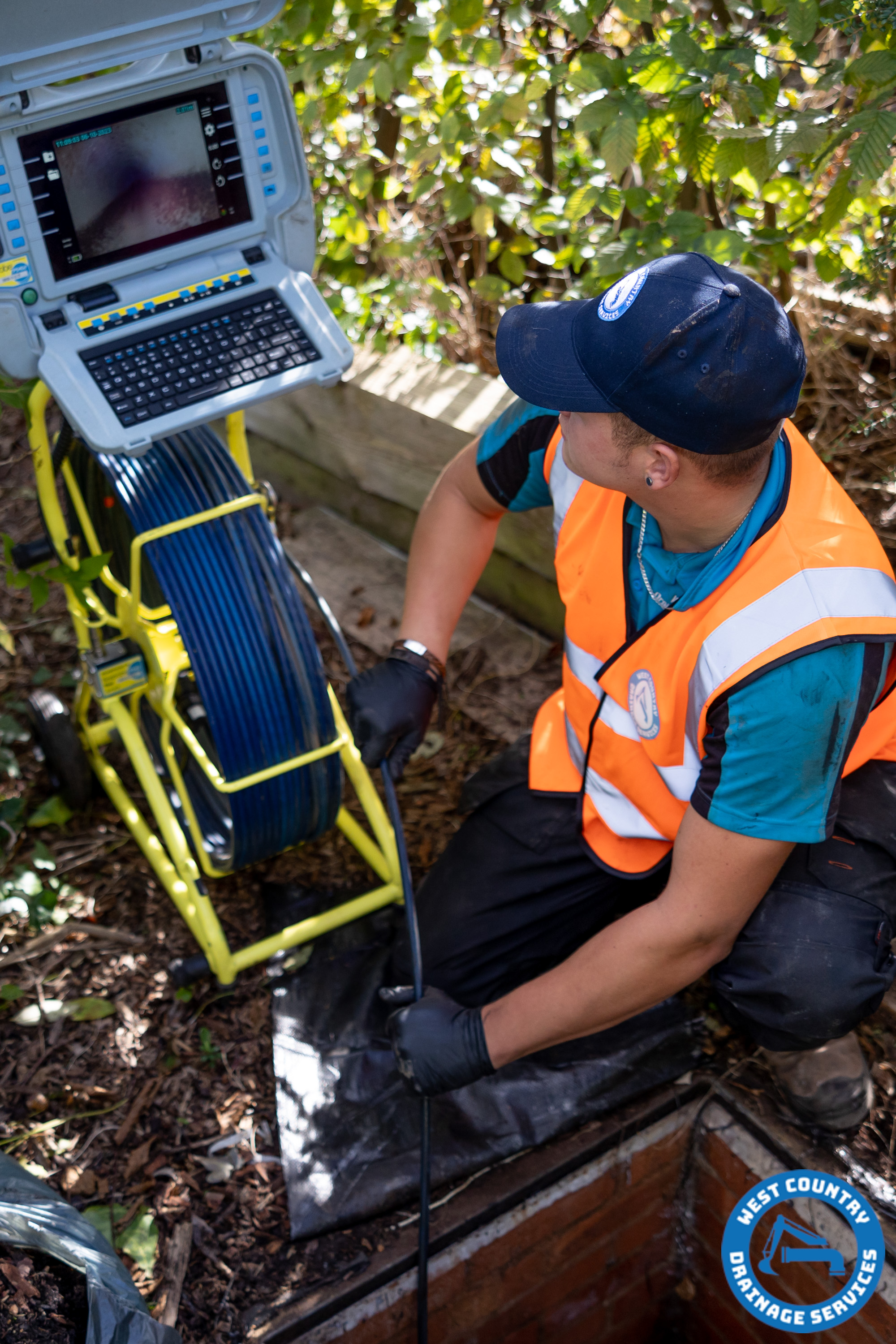 Drainage Engineer Technician using our CCTV camera system to inspect a damaged drain prior to a non-dig repair.